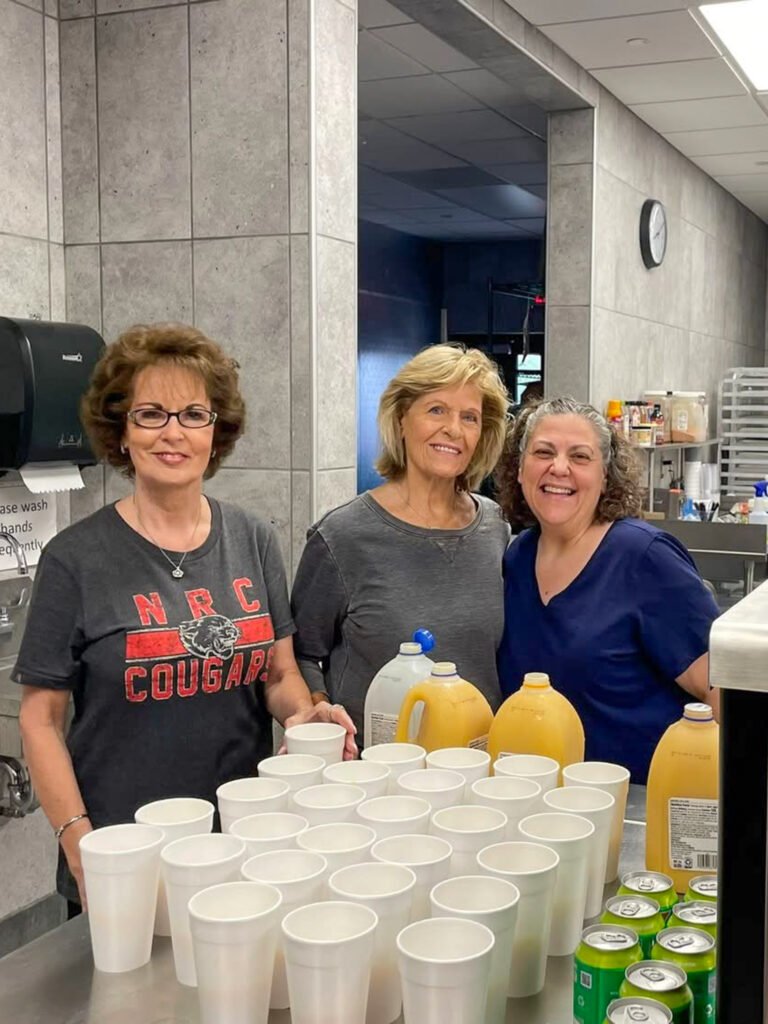 women smiling in kitchen